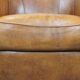 Cognac-colored sheep leather club chair with patina