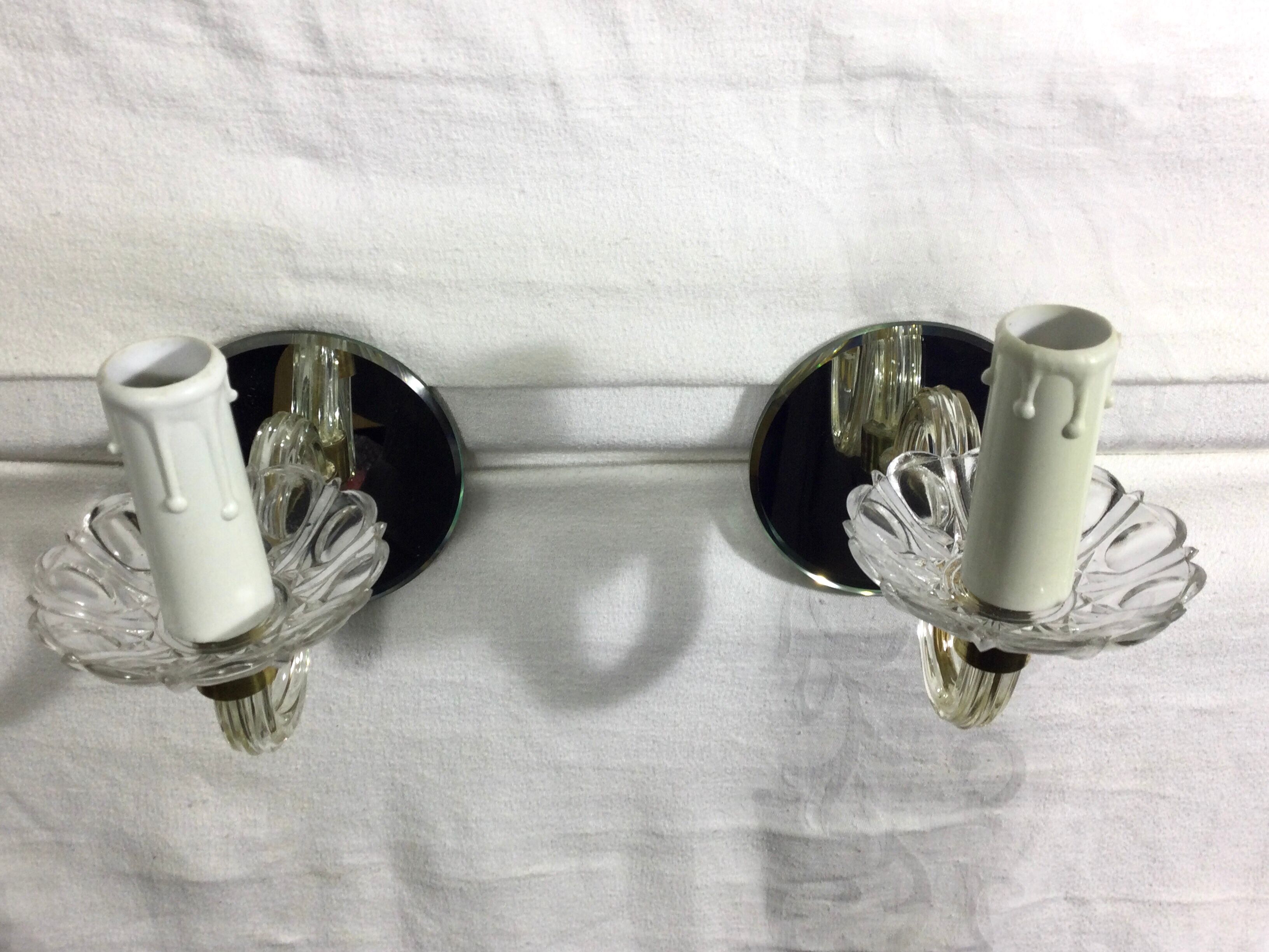 Pair of glass and mirror sconces