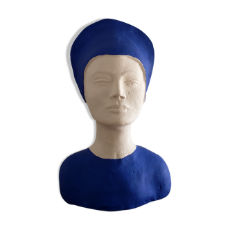 Bust of a woman in white and blue plaster