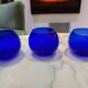 Set of 3 blue glass candle holders