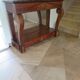 Empire/Restoration style console table with scrolled ends, mirrored back, and claw feet.