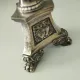 Old church candlestick in silver-plated metal