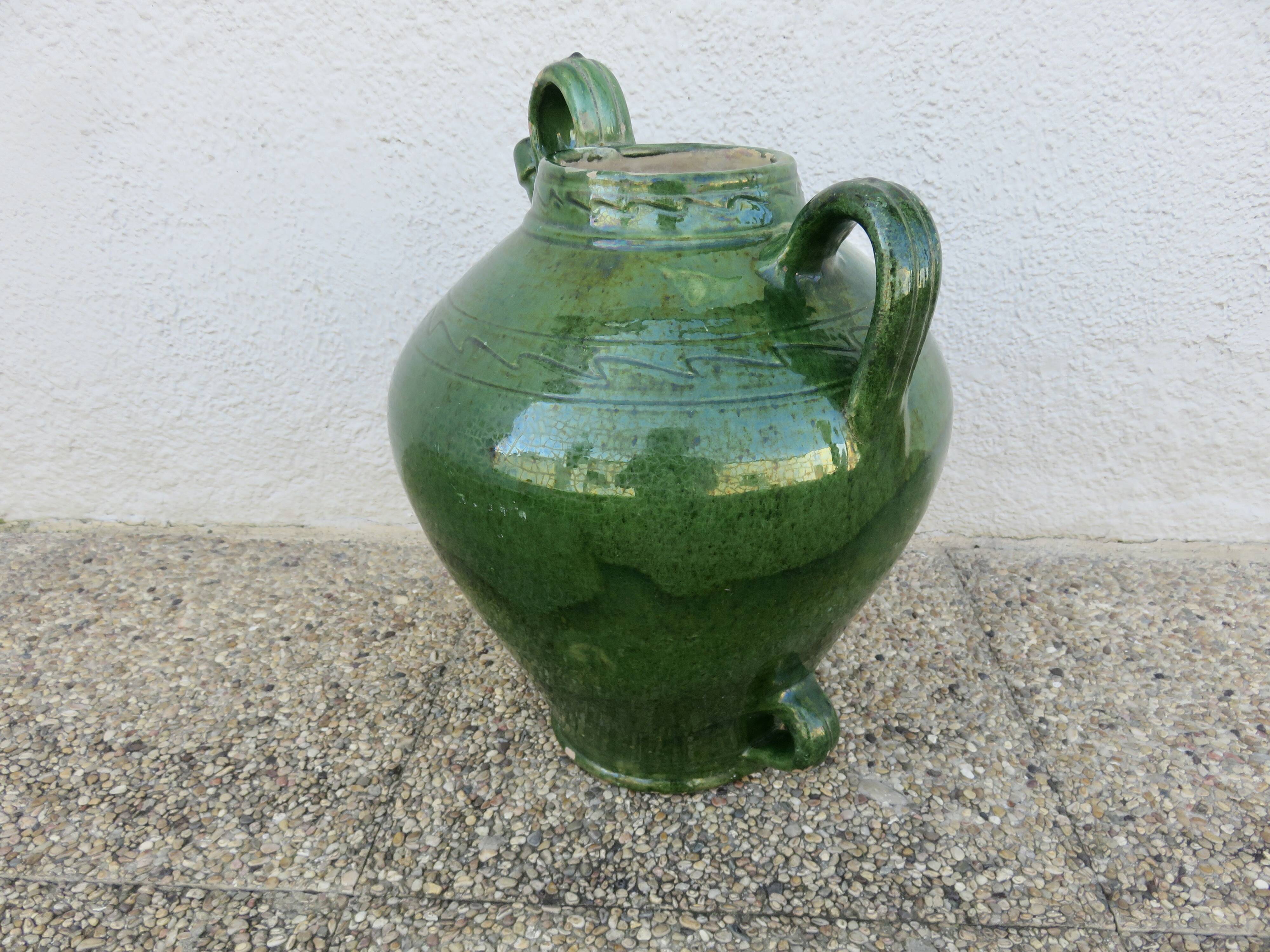 Antique glazed green terracotta oil jar, late 19th century.