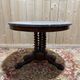 Round tripod gueridon from the Empire period with claw feet in mahogany and marble.