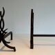Pair of Wrought Iron Andirons with Stylised Flamboyant Uprights and Enrobed Feet