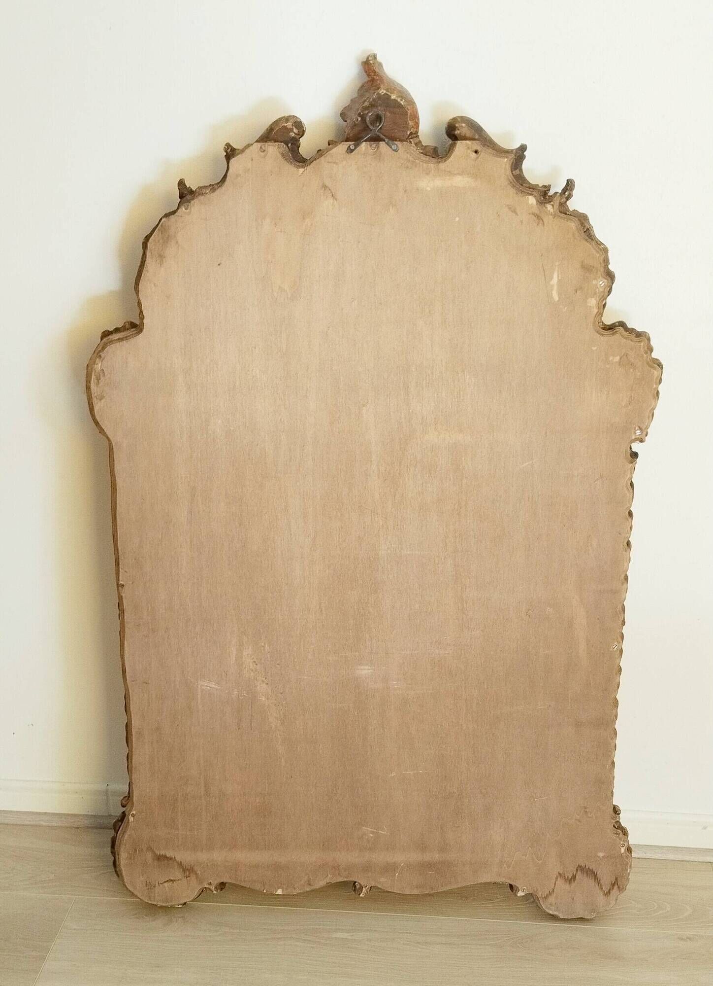 Antique mirror with rococo-style pareclose, in gilded wood, 19th century