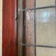 Late 19th century store doors, haberdashery front with Art Nouveau stained glass windows