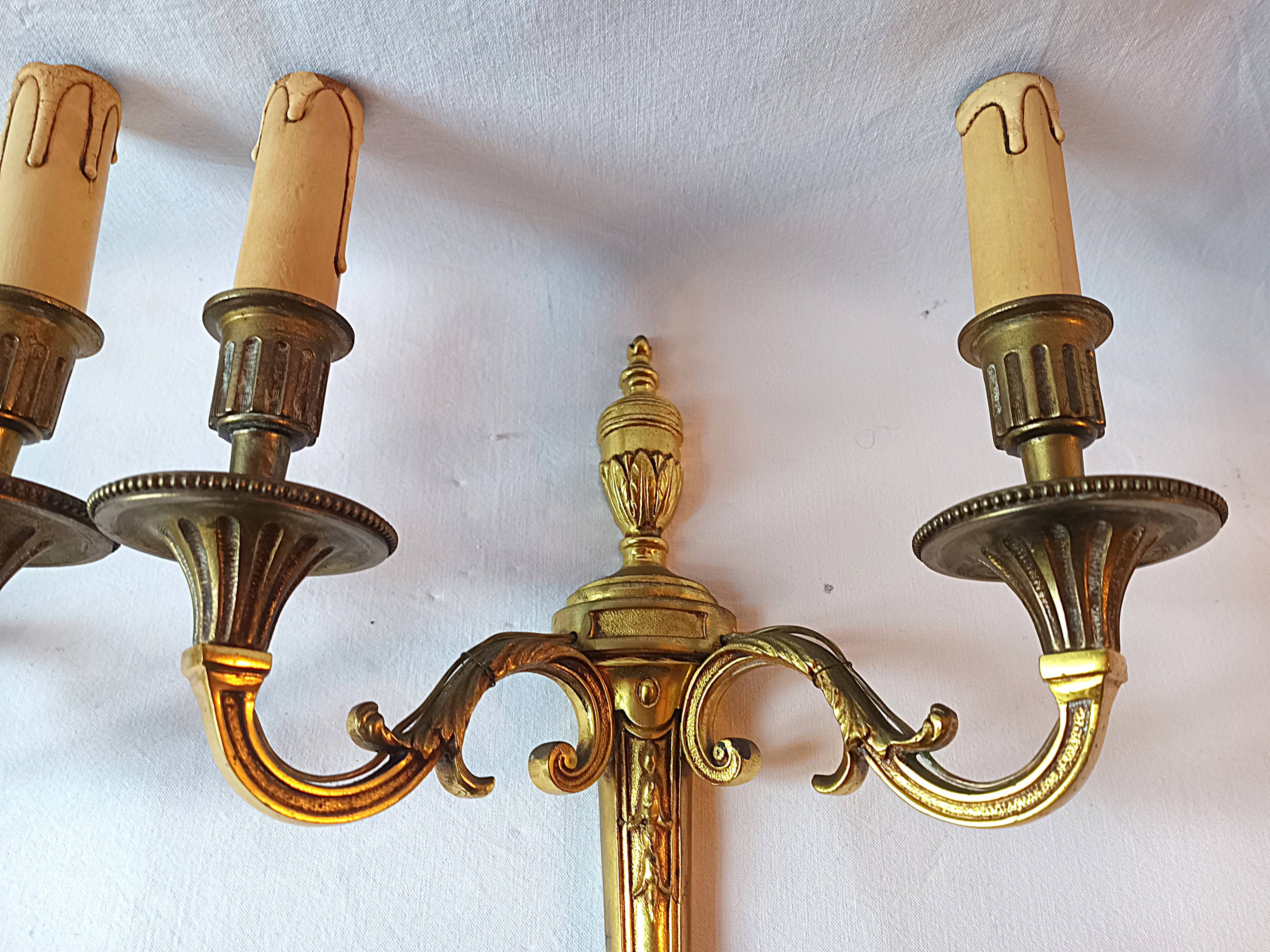 Pair of bronze wall sconces in Louis XVI style