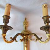 Pair of bronze wall sconces in Louis XVI style