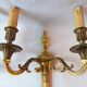 Pair of bronze wall sconces in Louis XVI style