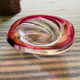 Empty pocket in pink tinted glass