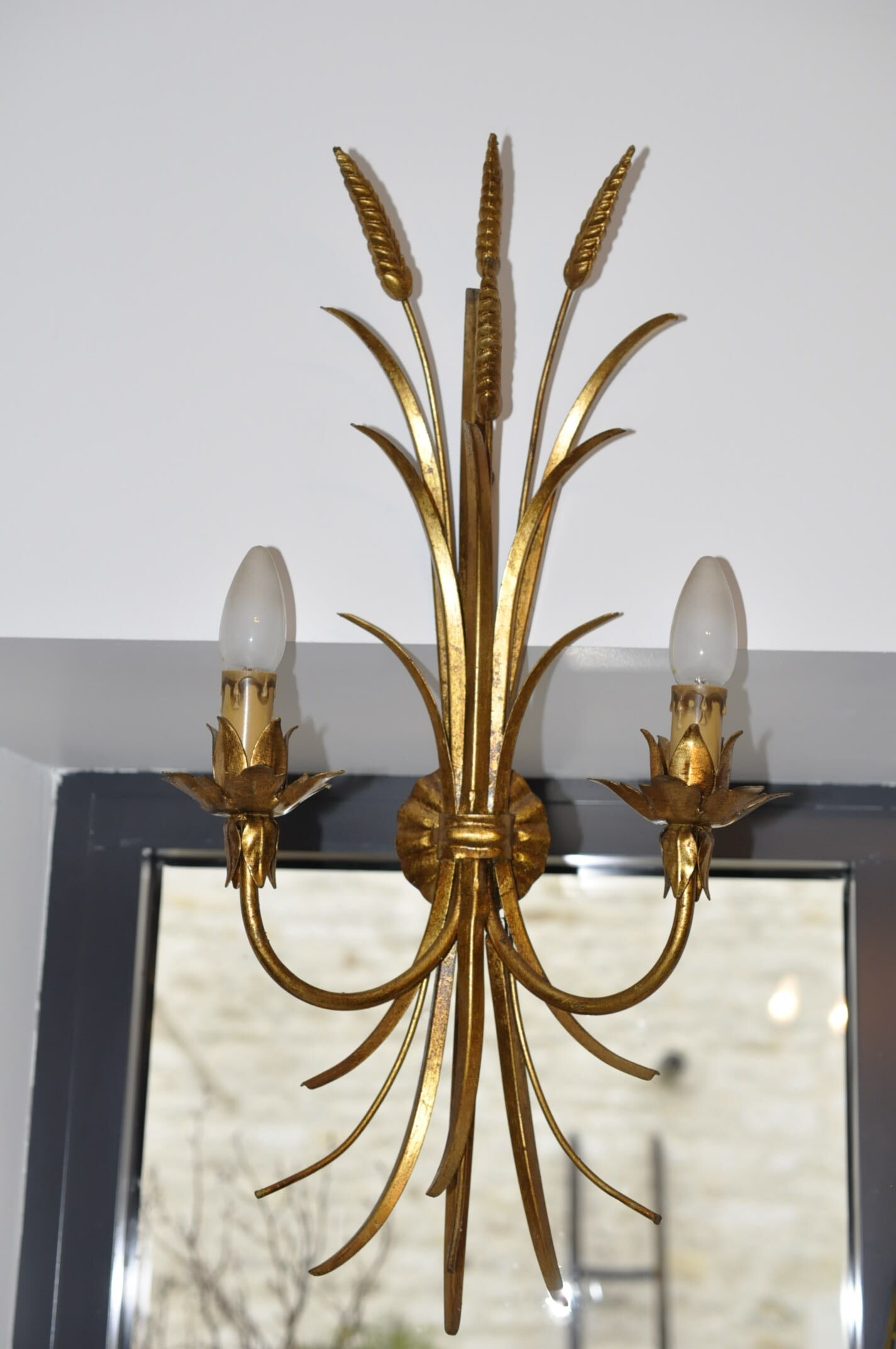 Golden metal wall sconce