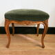 Louis XV footrest in carved wood and green velvet