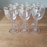 Set of 6 glasses with gold band decorations.