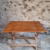Vintage folding garden table in pine, mid-20th century.