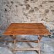 Vintage folding garden table in pine, mid-20th century.