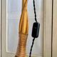 Rattan lamp post base with magazine holder