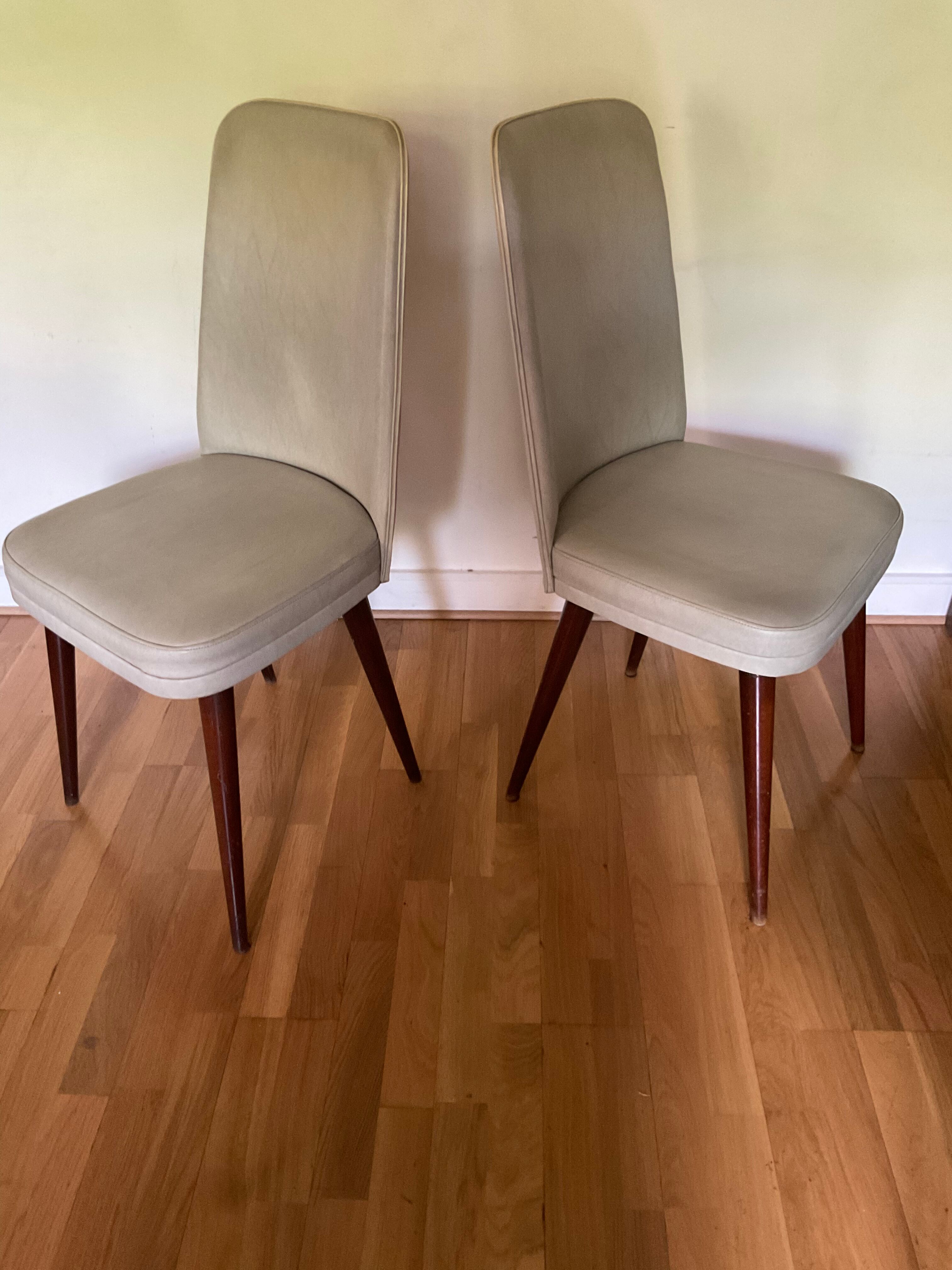 Pair of vintage mahogany and skai chairs