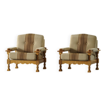 Mid-20th century, pair of lounge chairs signed Henning Kjærnulf, oak and wool, 1960s.