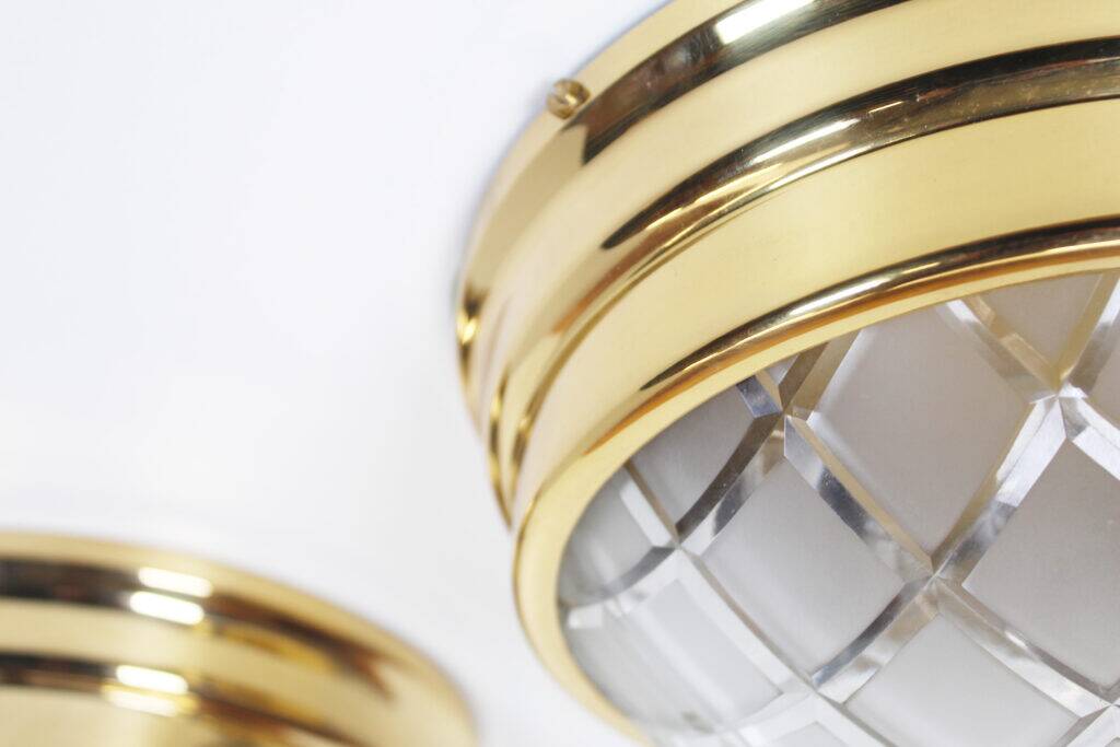 Pair of vintage brass ceiling lights with glass globe