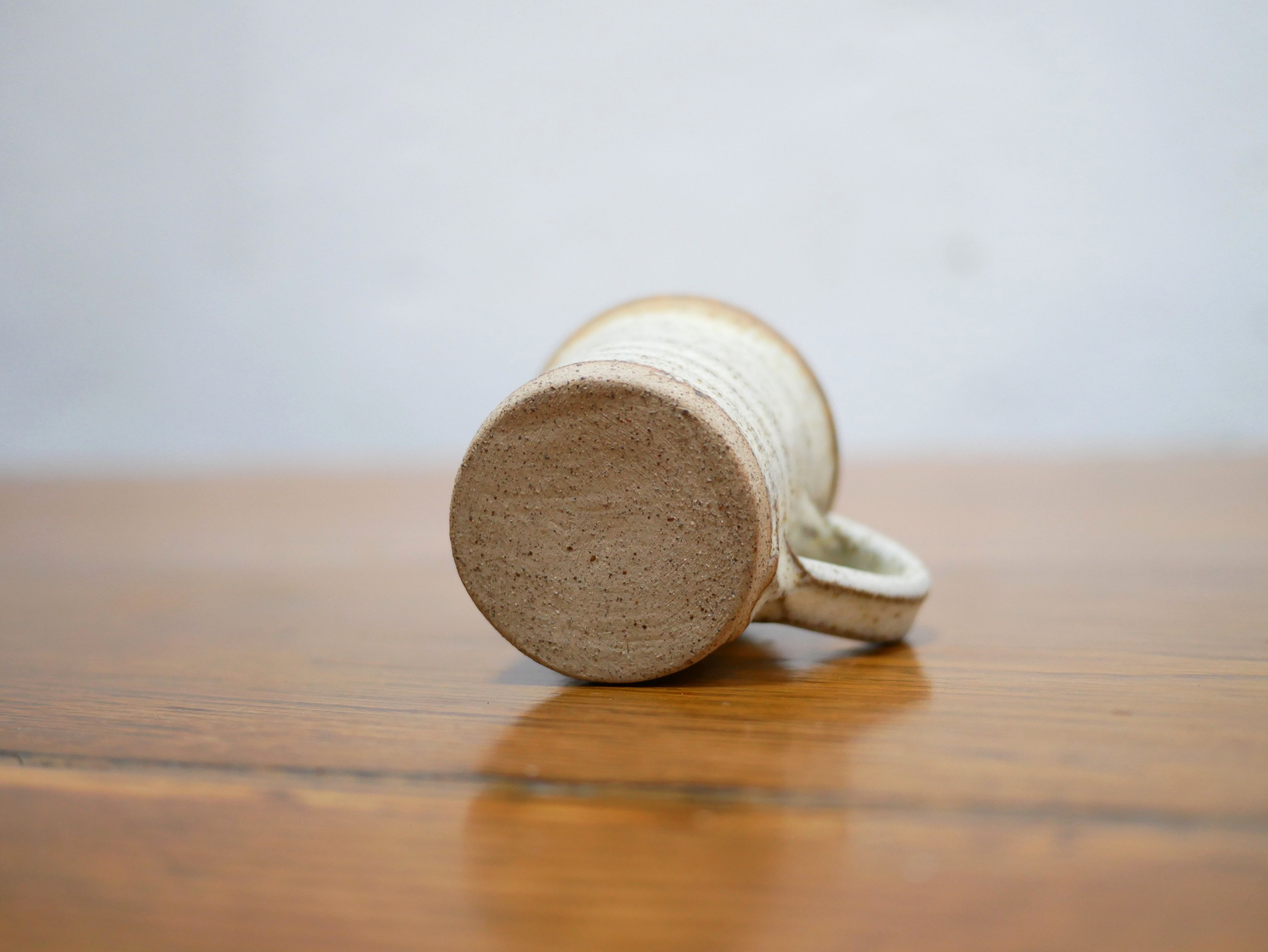 Series of 4 cups and a vintage stoneware milk jug