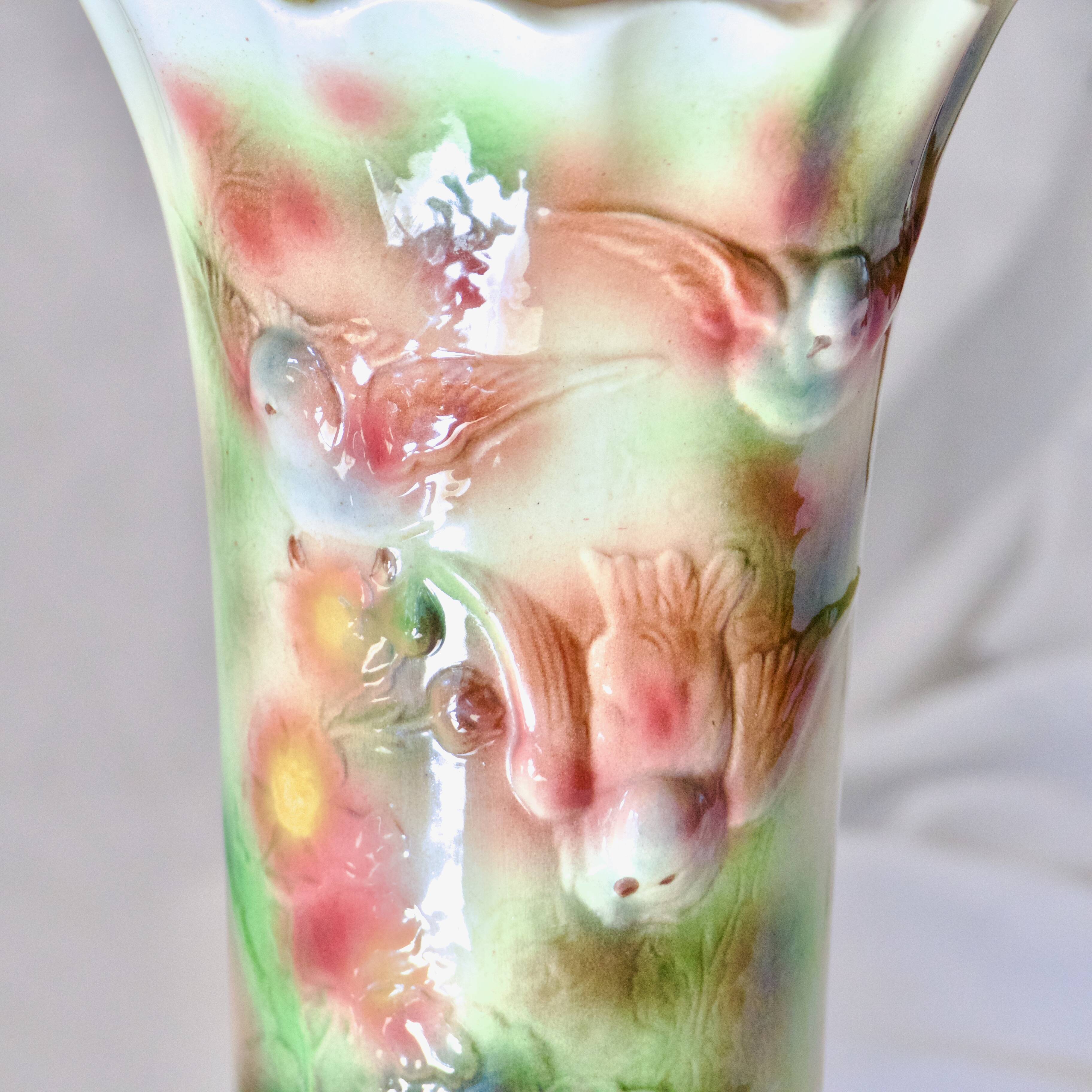 Antique Saint Clément slip roller vase with bird decor