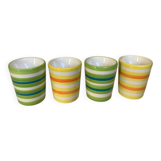 Four striped egg cups in yellow and green.