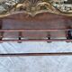 Coat rack and wall-mounted hat rack in an antique style.