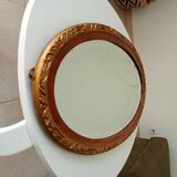 Antique oval mirror with beveled glass in wood and stucco, 19th century