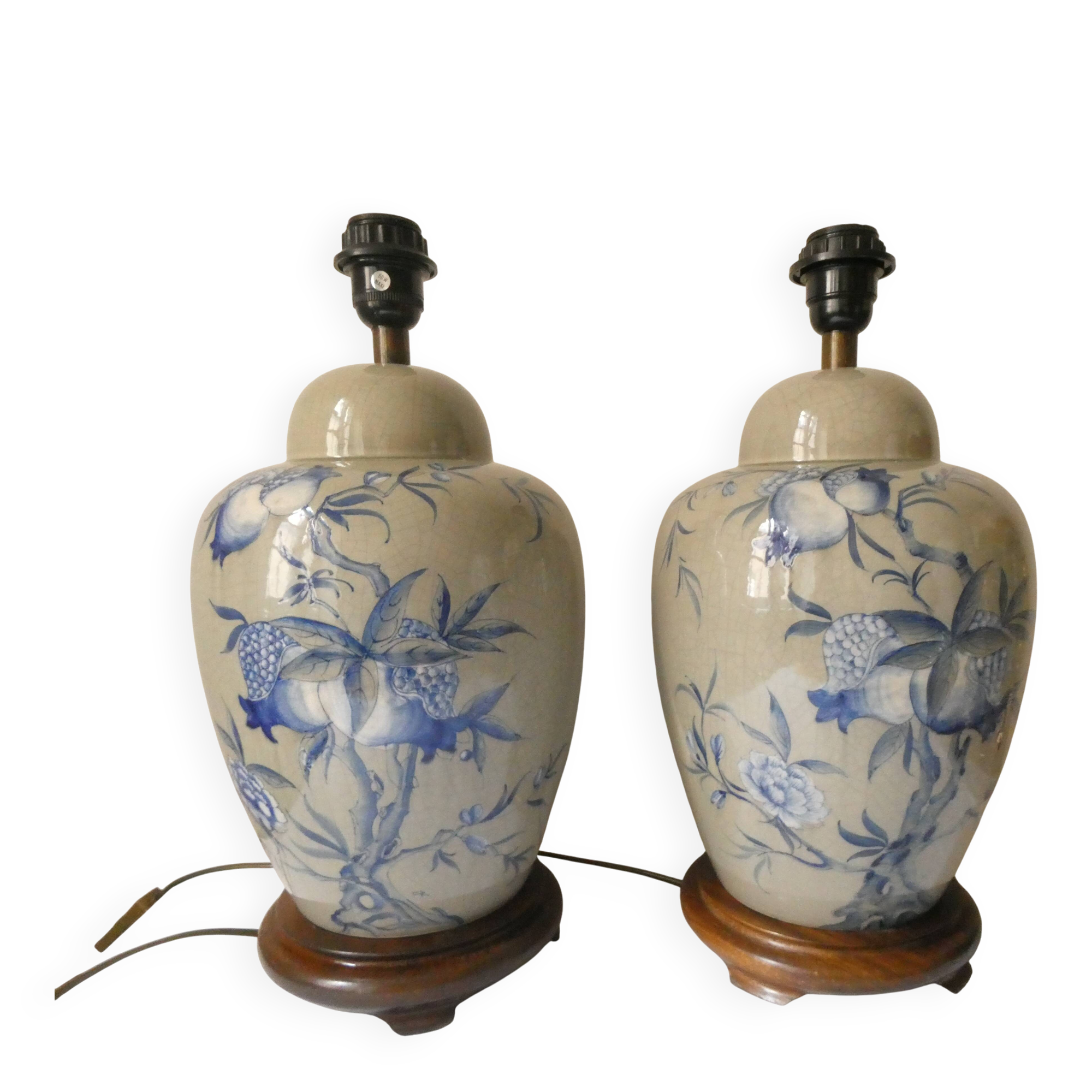 Pair of celadon crackle ceramic lamp bases decorated with flowers.