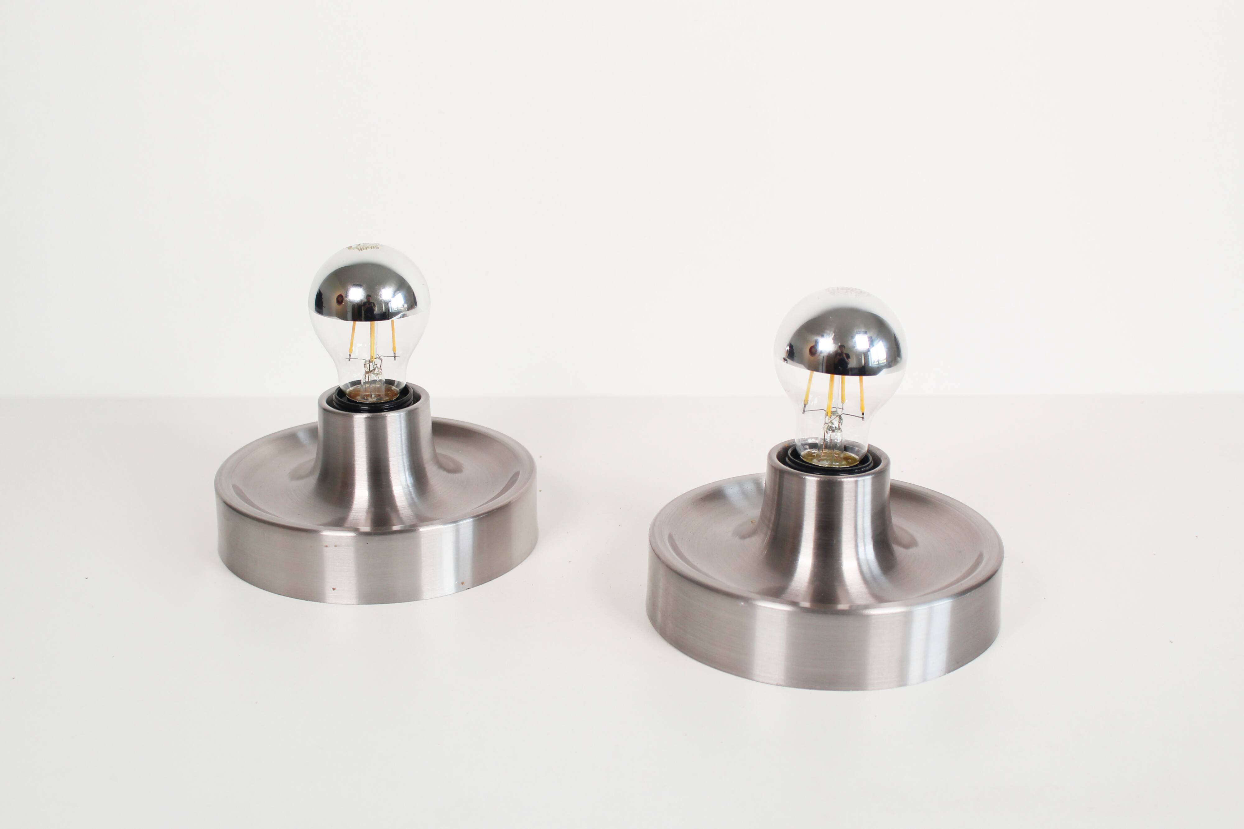 Pair of petite Disc sconces selected by Charlotte Perriand for Les Arcs