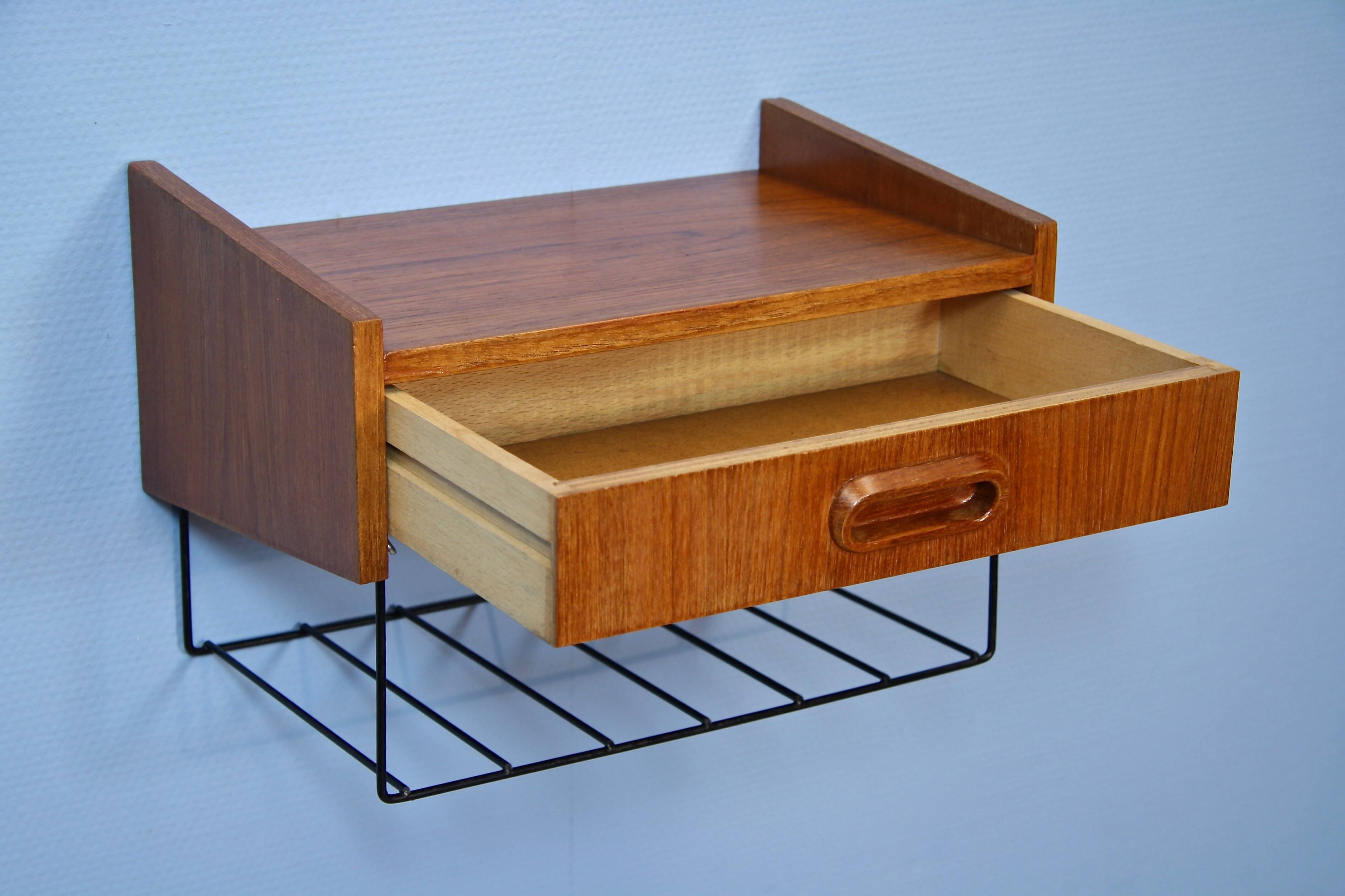 Dutch wall shelf by Tomado in teak and metal, 1960s.