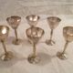 Set of 6 mini goblets on a pedestal in Art Deco style made of silver-plated metal with crests.
