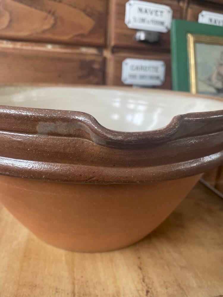 Antique spouted jug in terracotta