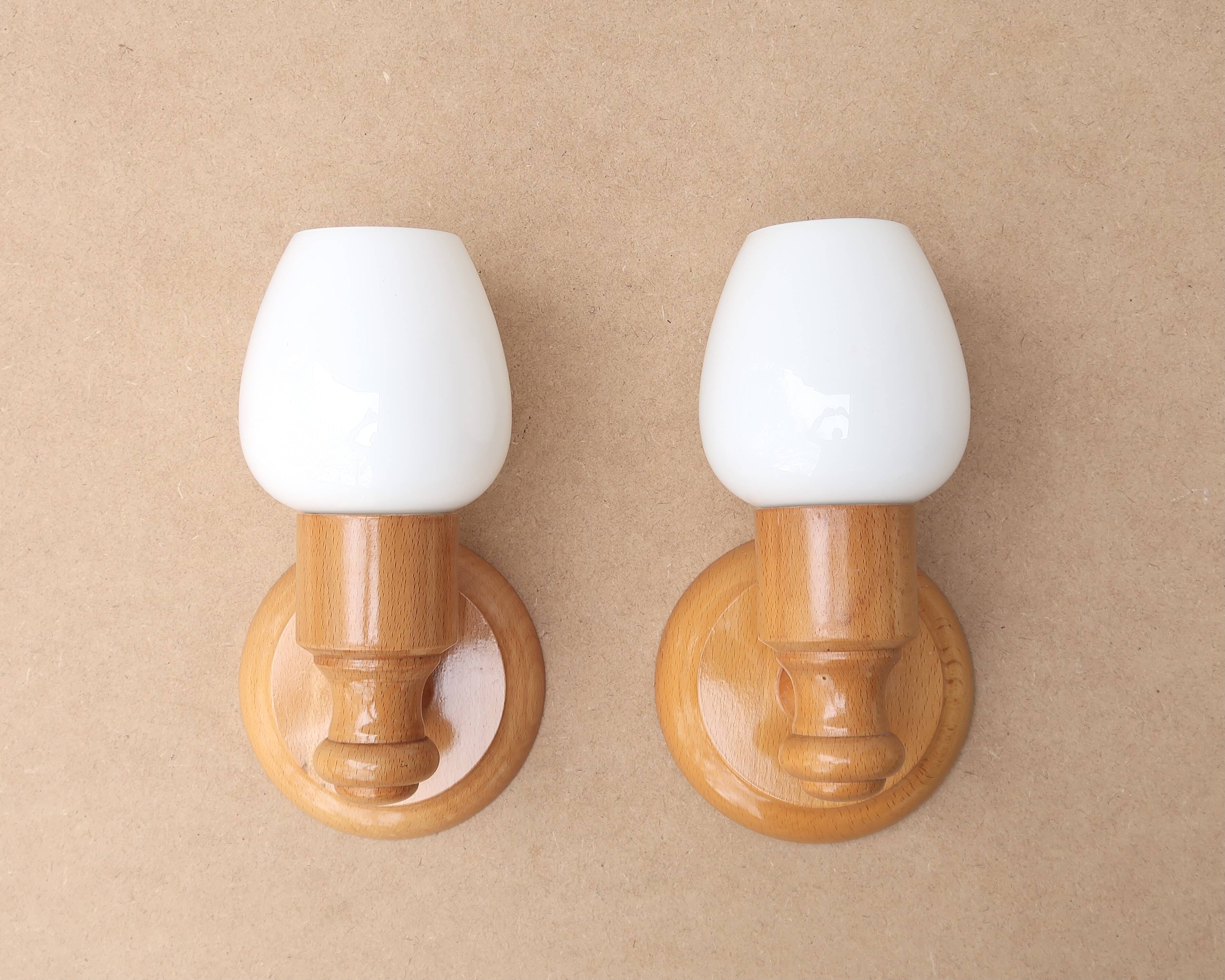 Pair of pine wood and white glass wall lights, 1970s