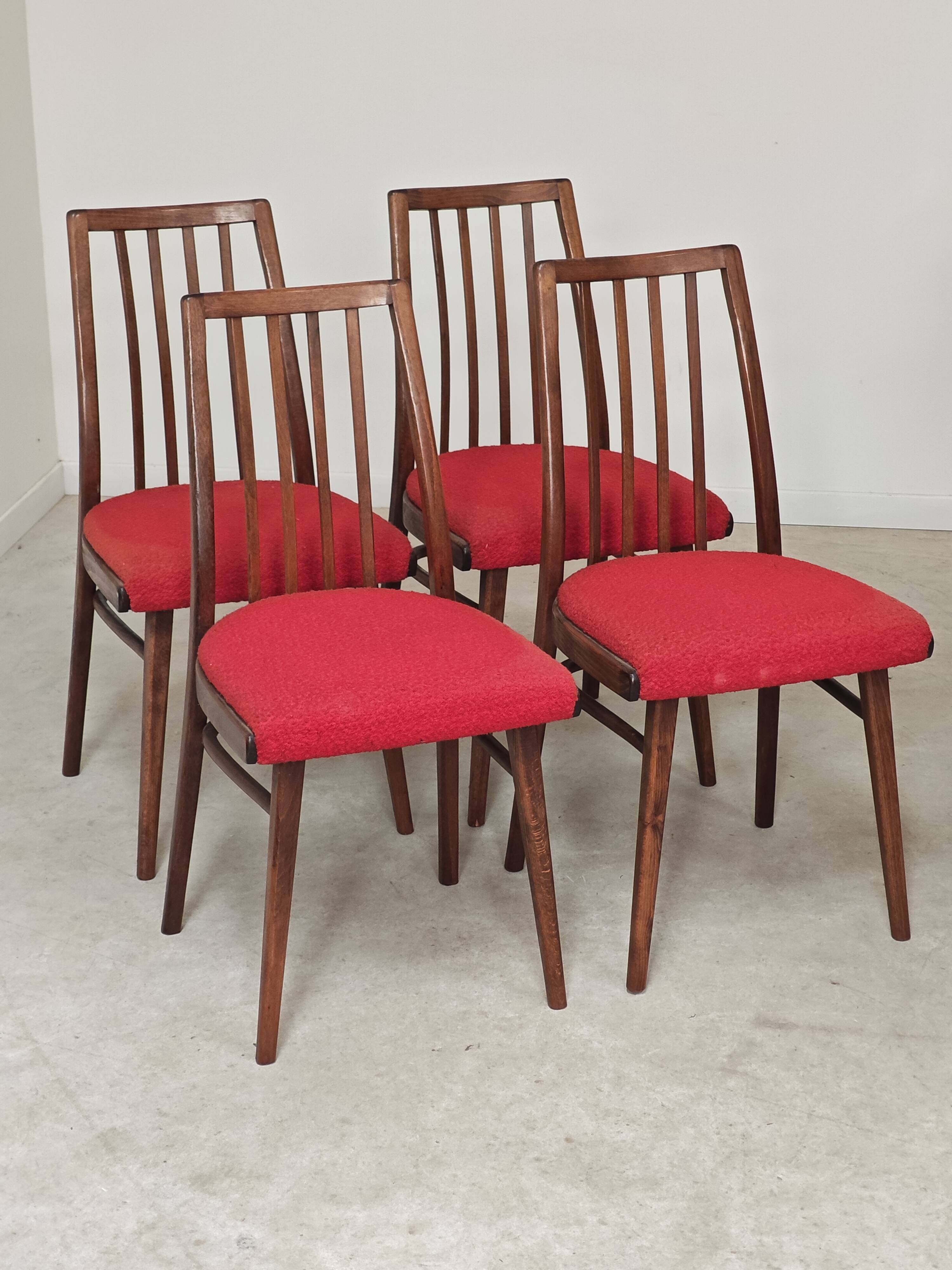 Set of 4 red dining chairs by Antonin Suman for Interier Praha.