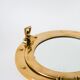 Porthole mirror in gilded brass, 1950
