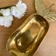 Empty vintage pear-shaped brass pocket