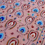 Salmon pink suzani kilim rug with embroidered patterns