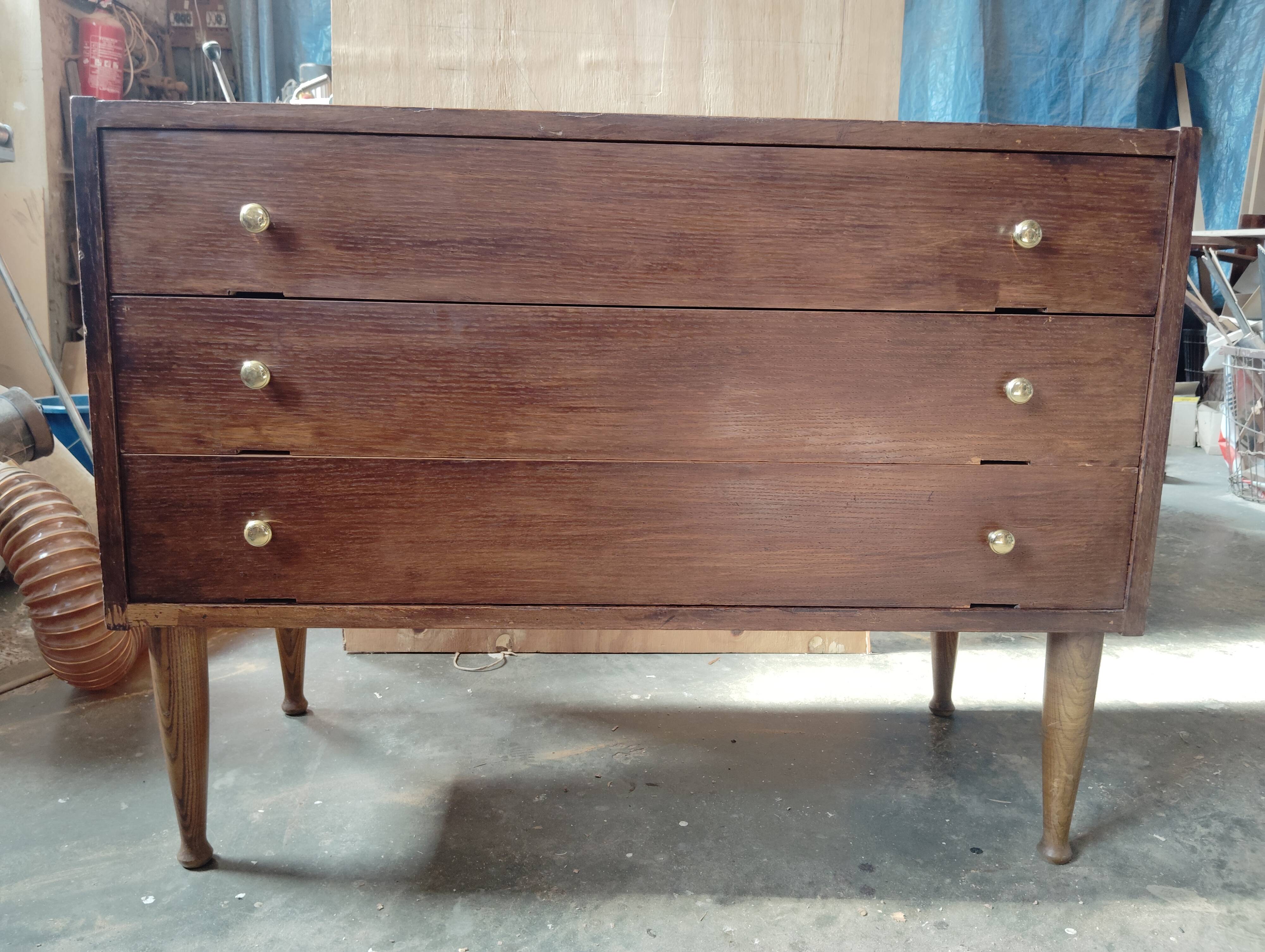 Vintage commode with tapered legs.