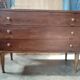 Vintage commode with tapered legs.