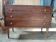 Vintage commode with tapered legs.