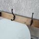 antique coat rack with 3 cast iron hooks