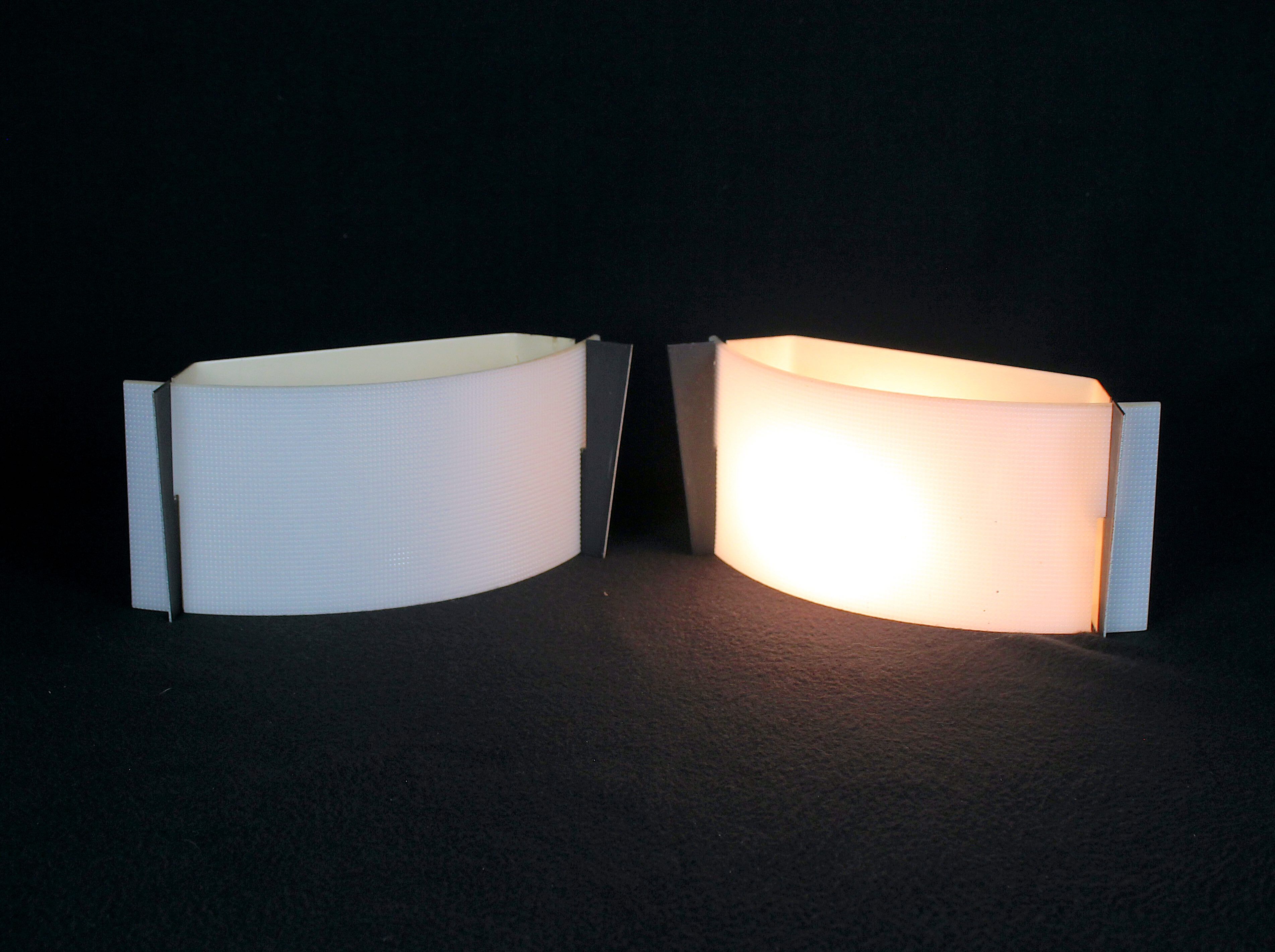 Pair of mid-century wall lamps in black metal and perspex, france