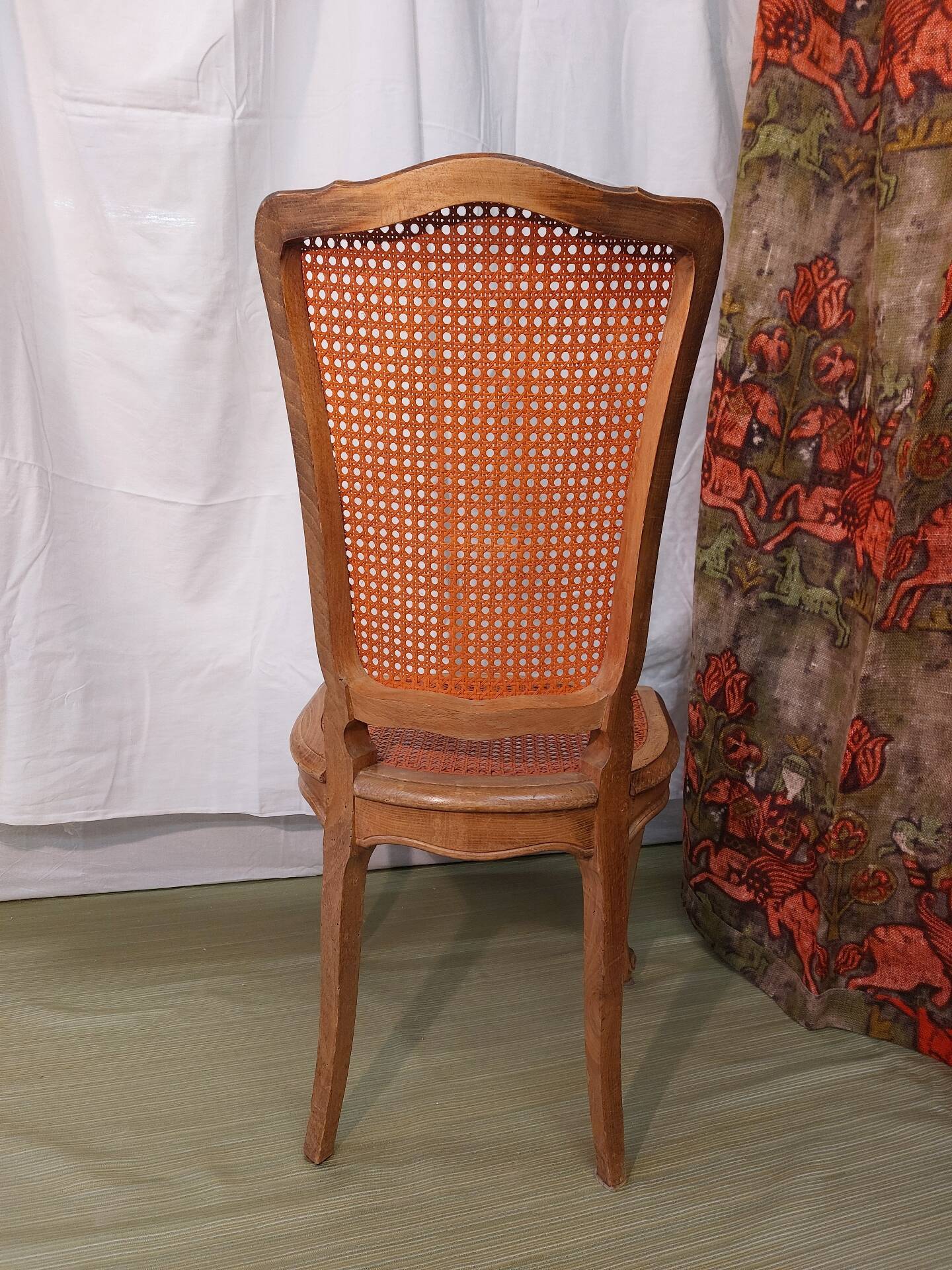 Caned chair in Louis XV style painted orange.