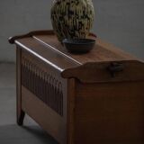 Modern Danish oak commode with decorative relief sculpture, mid-20th century.