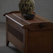 Modern Danish oak commode with decorative relief sculpture, mid-20th century.