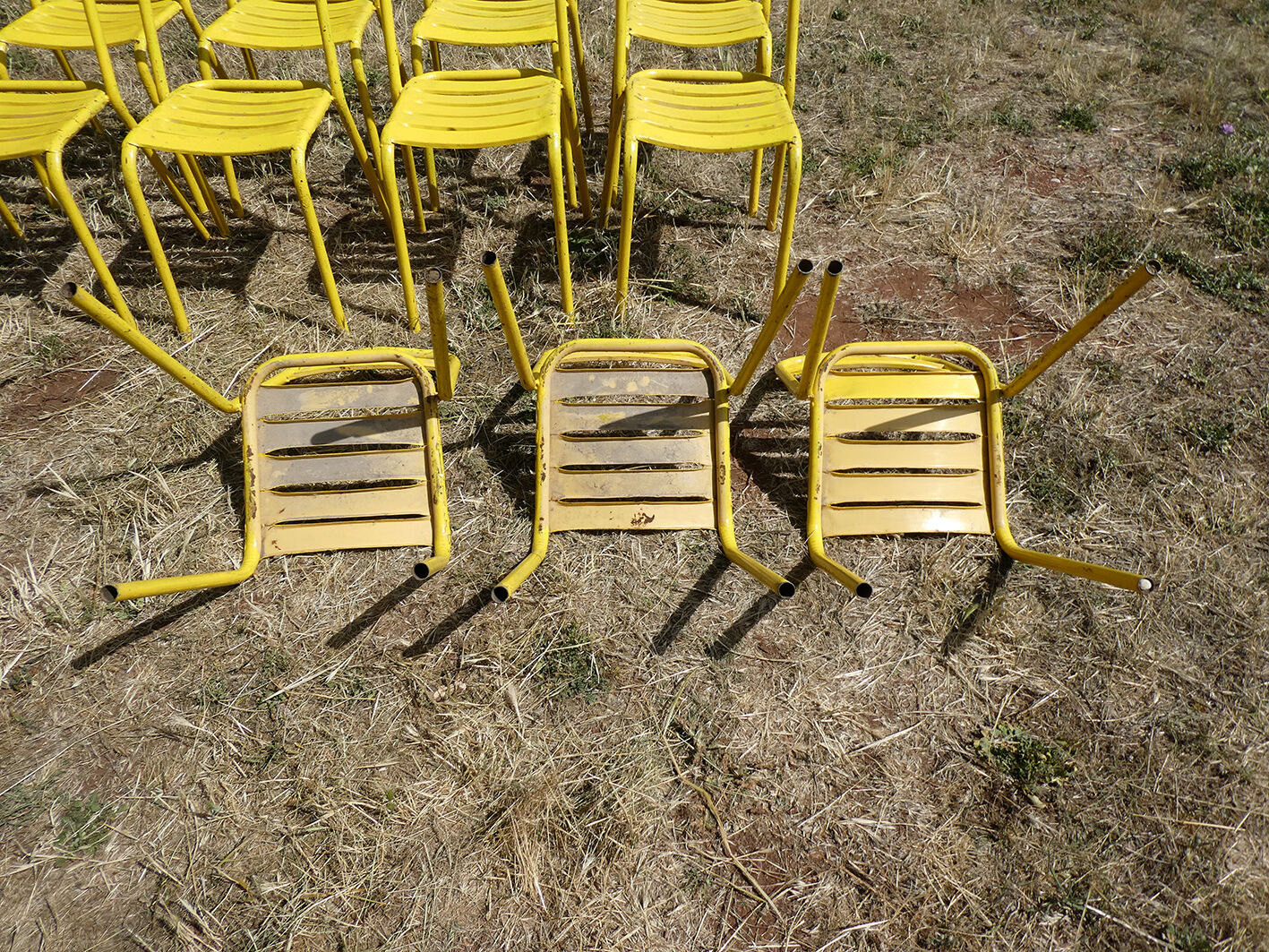 Lot of 11 yellow metallic bistro chairs from the 1950s