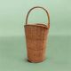 Old woven wicker umbrella stand