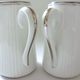 Pair of creamers in white porcelain enhanced with platinum